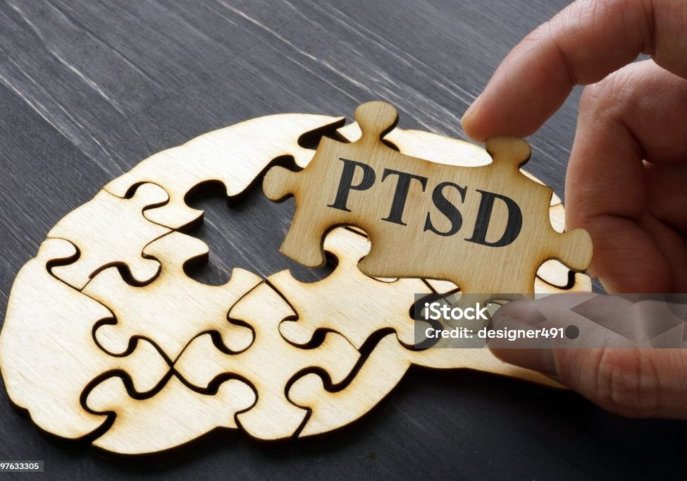 PTSD Post Traumatic Stress written on the puzzle.